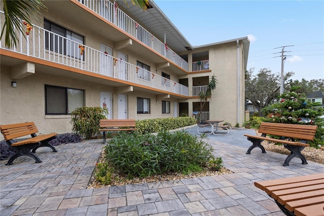 surrounding community featuring a patio