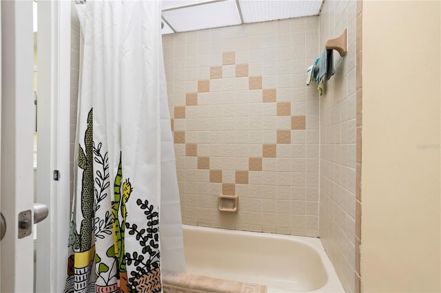 bathroom featuring shower / bath combination with curtain