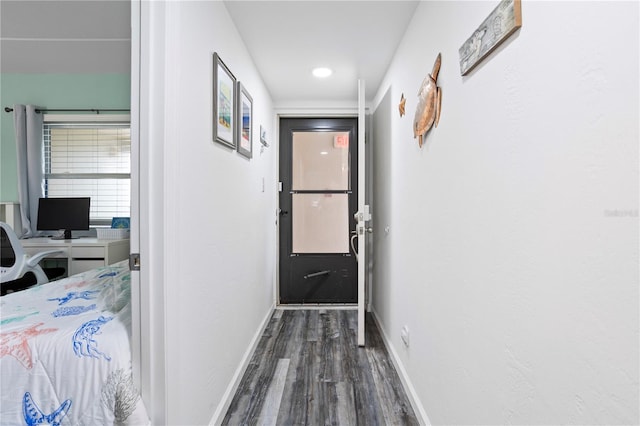 hall with dark hardwood / wood-style floors