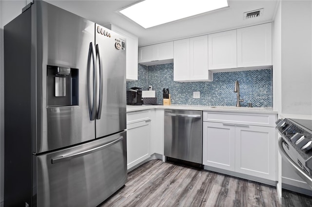 kitchen with white cabinetry, sink, and appliances with stainless steel finishes