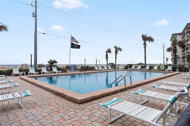 view of swimming pool with a patio