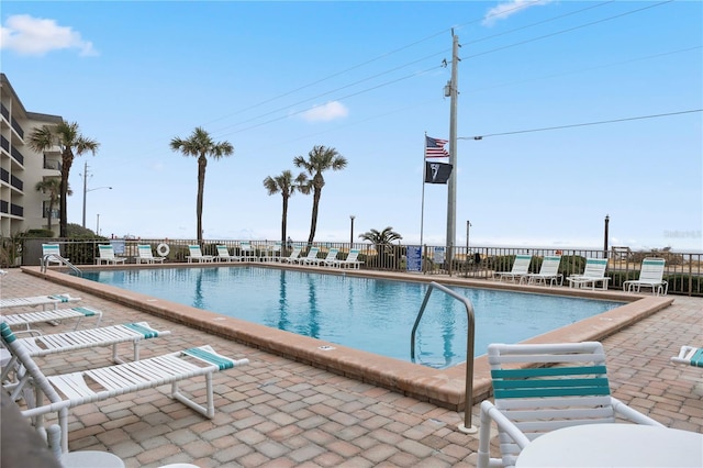 view of swimming pool with a patio area