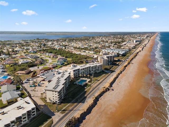 aerial view featuring a view of the beach and a water view