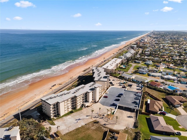 aerial view featuring a water view and a beach view