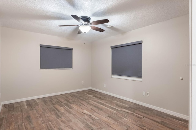 spare room featuring ceiling fan, a textured ceiling, and hardwood / wood-style flooring