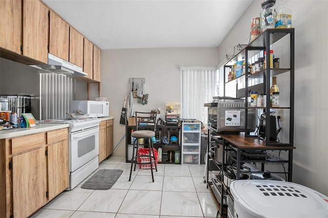 kitchen with extractor fan and white appliances