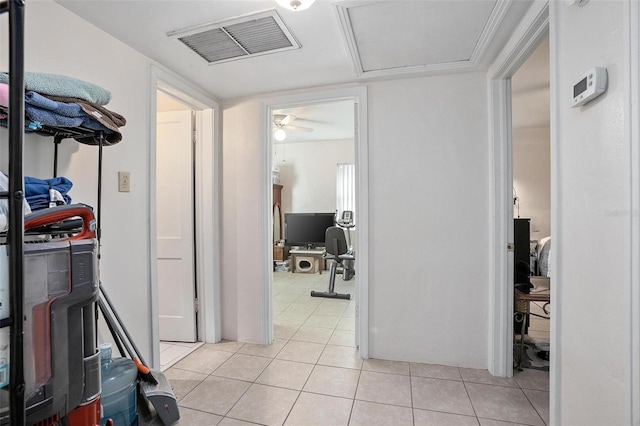 hall featuring light tile patterned floors