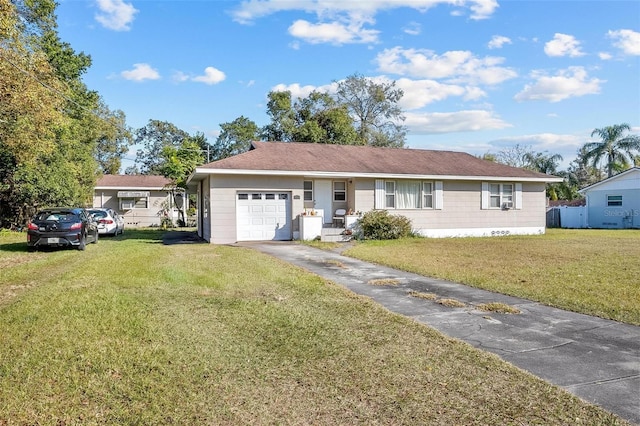 single story home featuring a garage and a front yard