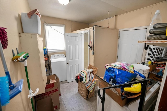 interior space with washer / clothes dryer and light tile patterned floors