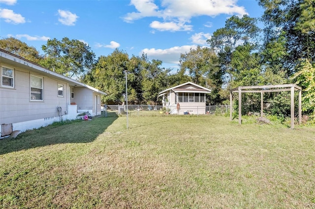 view of yard featuring a sunroom