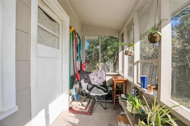 sunroom featuring lofted ceiling