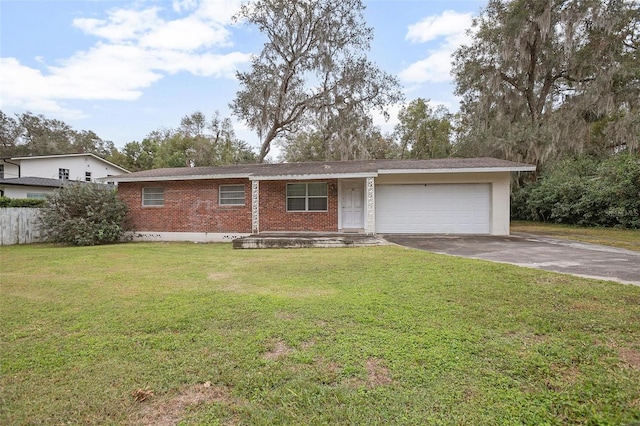 ranch-style house with a garage and a front lawn