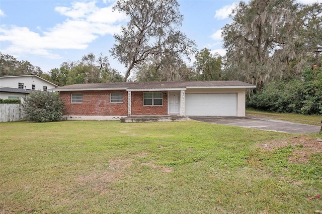 single story home featuring a front lawn and a garage