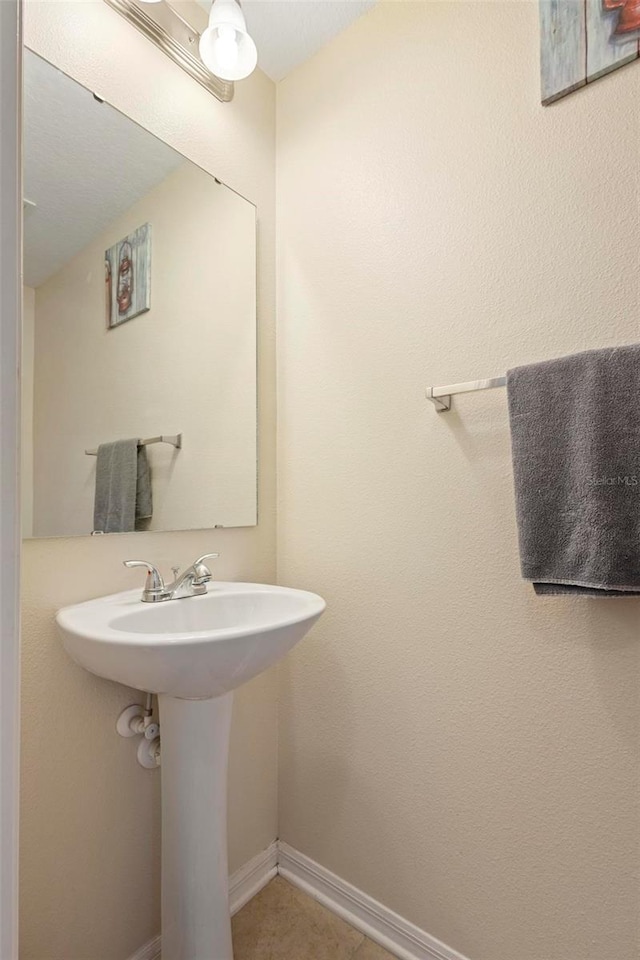 bathroom with tile patterned floors