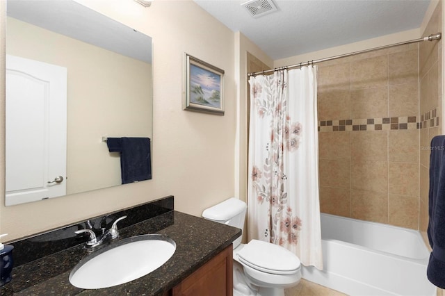 full bathroom with shower / bath combo, vanity, a textured ceiling, and toilet