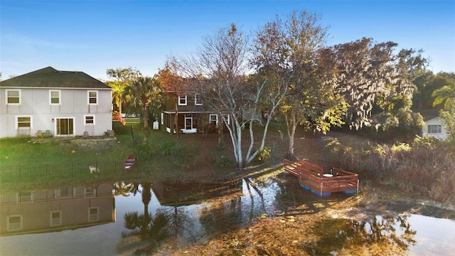 exterior space with a lawn and a water view