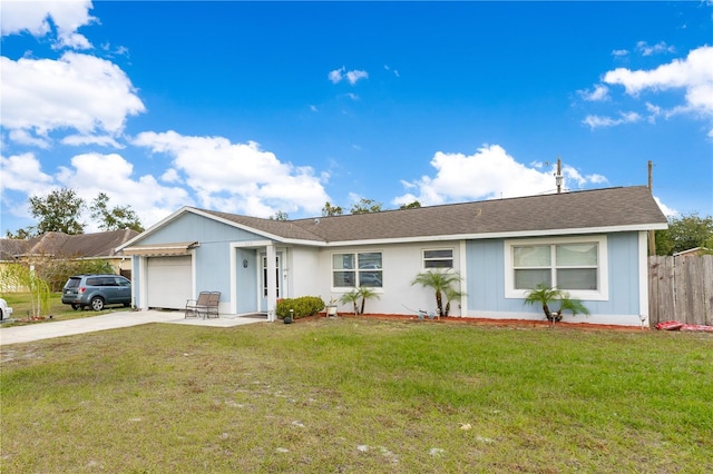 ranch-style house with a garage and a front lawn