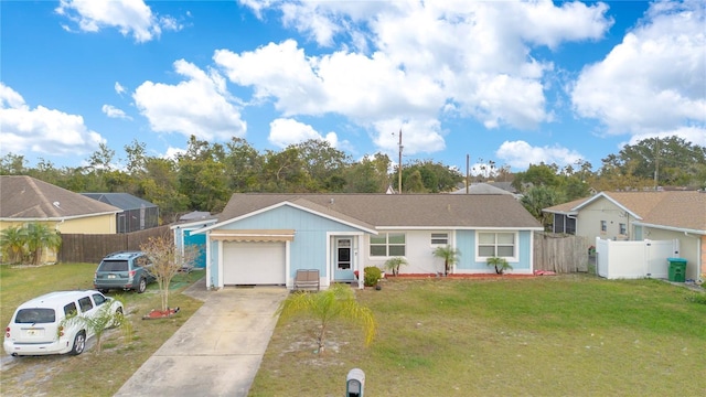 single story home featuring a garage and a front yard