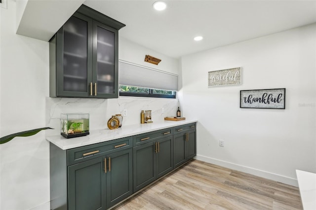 bar featuring light hardwood / wood-style floors