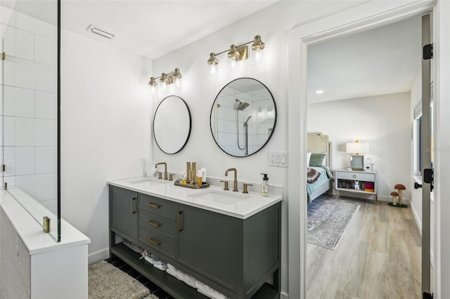 bathroom with hardwood / wood-style flooring and vanity