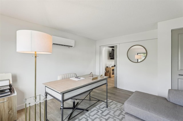 office with wood-type flooring and a wall unit AC