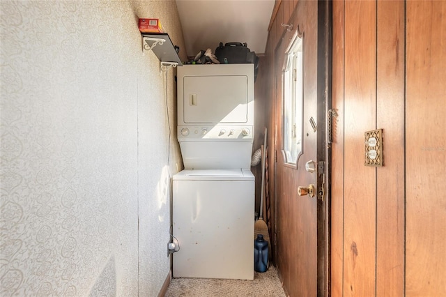 washroom with stacked washer and clothes dryer