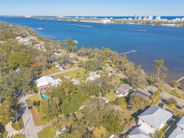 birds eye view of property with a water view