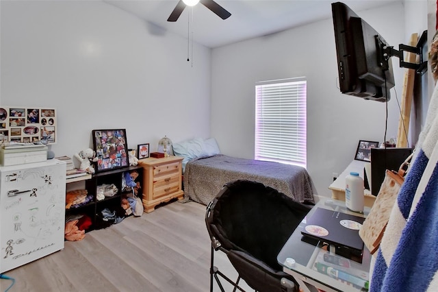 bedroom featuring ceiling fan and hardwood / wood-style floors