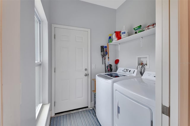 clothes washing area with washing machine and dryer