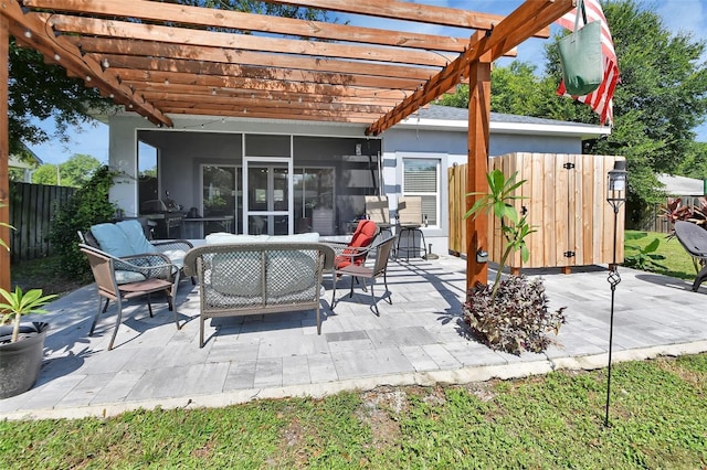 view of patio with outdoor lounge area, a pergola, area for grilling, and a sunroom