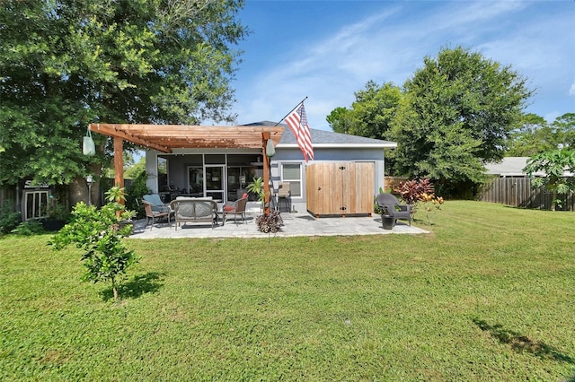 rear view of house featuring a yard, a pergola, and an outdoor hangout area