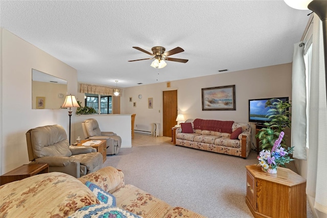 living room with ceiling fan, light carpet, and a textured ceiling