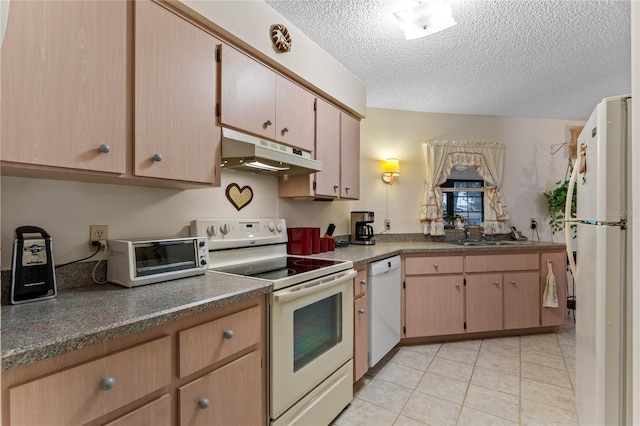 kitchen with sink, light tile patterned floors, white appliances, light brown cabinets, and a textured ceiling