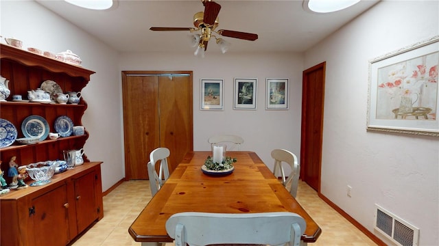 tiled dining area featuring ceiling fan