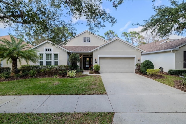 view of front of home with a garage and a front yard