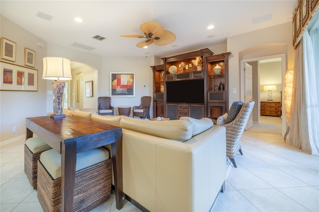 living room featuring ceiling fan and light tile patterned floors