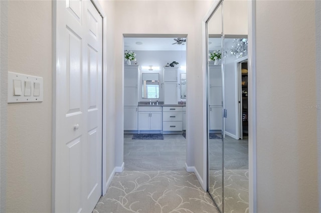 hallway featuring sink