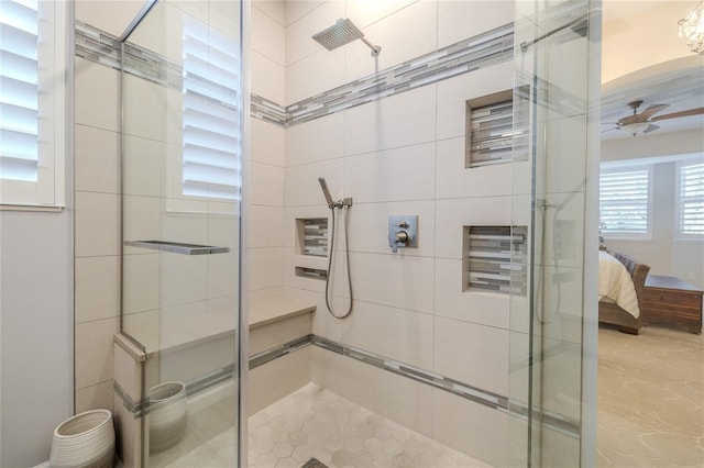 bathroom with ceiling fan and walk in shower