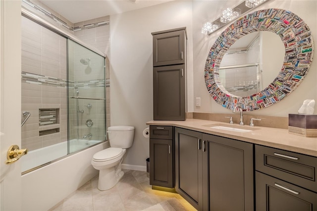 full bathroom featuring toilet, tile patterned flooring, enclosed tub / shower combo, and vanity