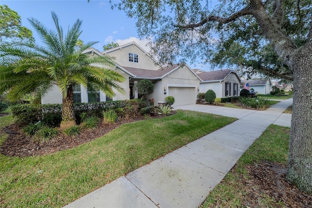 view of front of house featuring a front yard and a garage