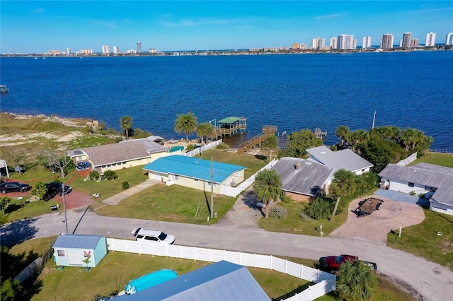 birds eye view of property with a water view