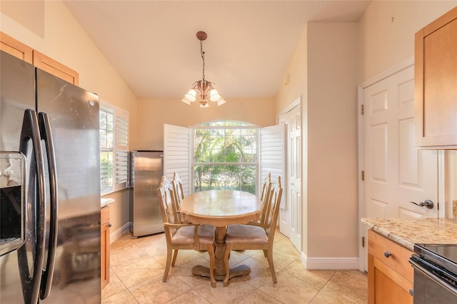 dining room featuring light tile patterned floors, a chandelier, and vaulted ceiling