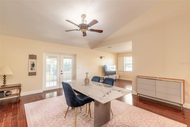 dining space featuring ceiling fan, dark wood-type flooring, french doors, and lofted ceiling