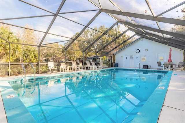 view of pool featuring a patio and glass enclosure