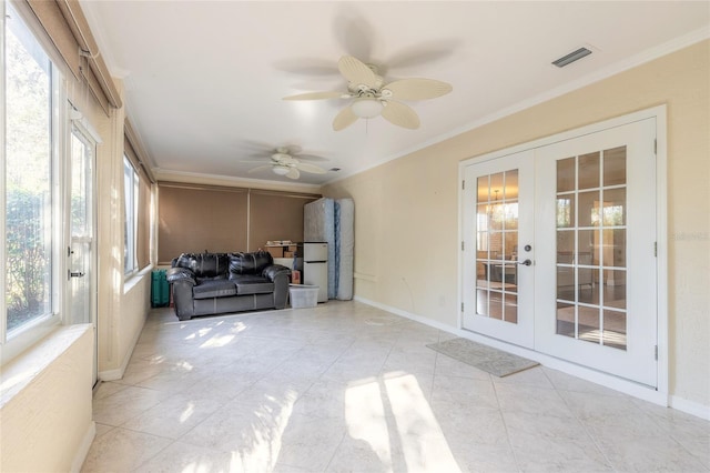 sunroom / solarium featuring french doors and ceiling fan