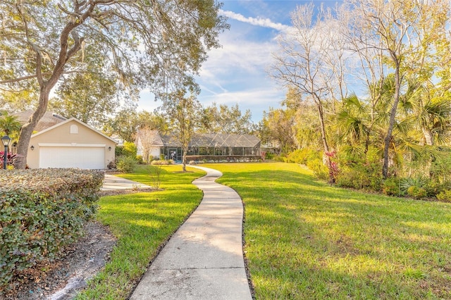 view of property's community with a lawn