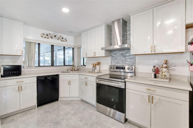 kitchen featuring a textured ceiling, white cabinetry, wall chimney exhaust hood, and black appliances