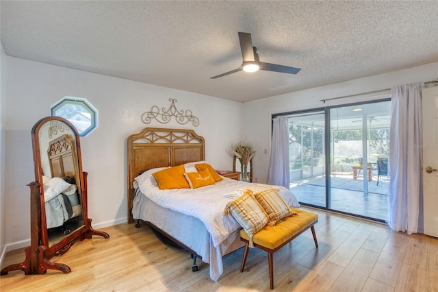 bedroom featuring a textured ceiling, light wood-type flooring, access to outside, and ceiling fan