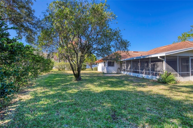 view of yard with a sunroom