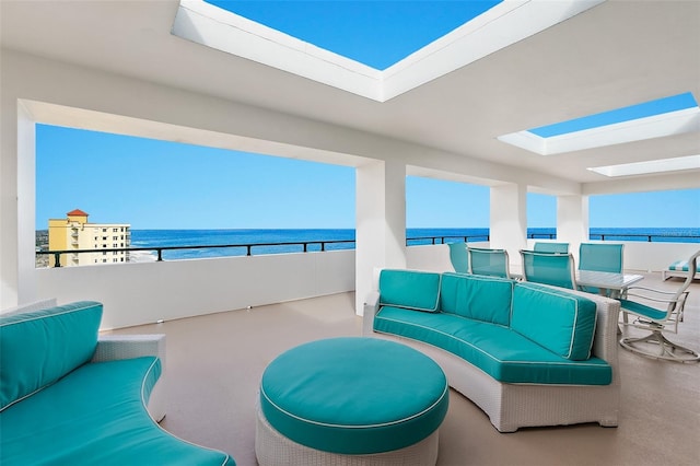 view of patio with an outdoor hangout area, a water view, and a balcony